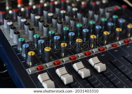 A mixing table in a music composer home studio Royalty-Free Stock Photo #2031403310