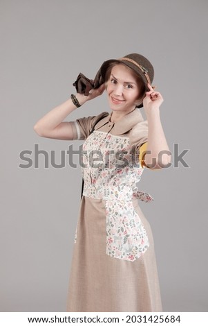 Woman actor reenactor in historical clothes of the German fashion during 1940-1945 Royalty-Free Stock Photo #2031425684