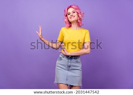 Photo of young cheerful girl happy positive smile dance glad party isolated over purple color background