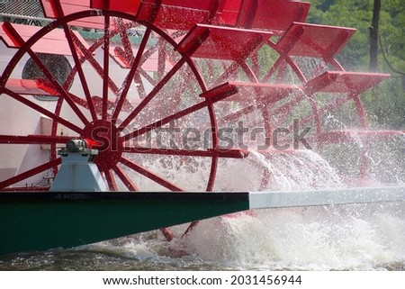close up of red paddlewheel boat on a river Royalty-Free Stock Photo #2031456944