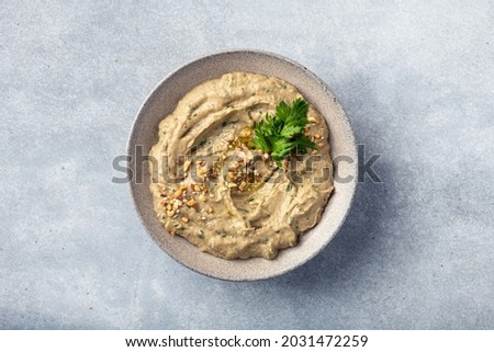 Baba ghanoush, baba ganoush or eggplant hummus, traditional Middle Eastern cuisine, top view, copy space Royalty-Free Stock Photo #2031472259