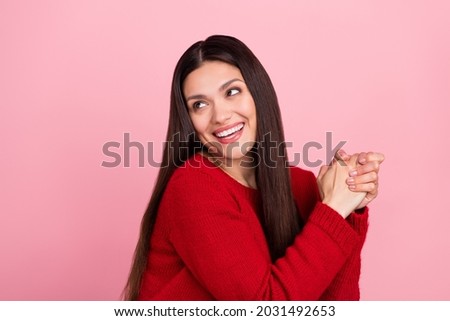 Photo of lovely brunette lady hold hands look empty space wear red pullover isolated on pink color background