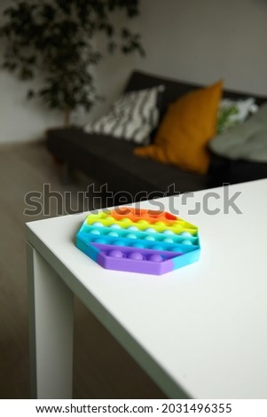 Push pop bubble sensory fidget toy octagon shape on table