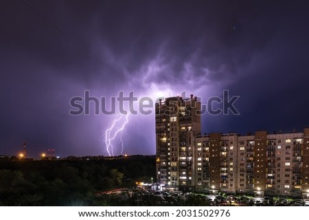 lightning on the background of residential buildings