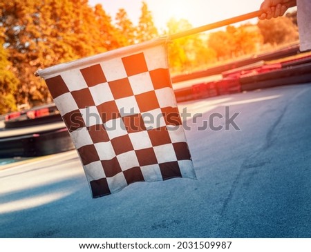 Checked flag at motorsport race track Royalty-Free Stock Photo #2031509987