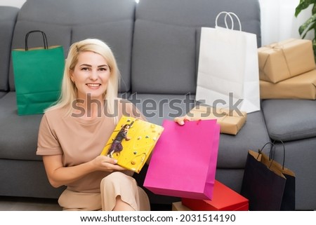 woman holding photocanvas. Holiday or special occasion gift concept.
