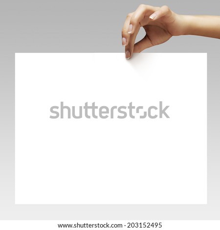 woman hands with ideal manicure holding the white sheet of paper