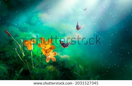 Golden Bluebells Flowers and flying Butterflies in Fantasy magical Emerald colored garden in fairy tale elf Forest, fairytale bells glade background, elven magic wood in dark night with moon rays.