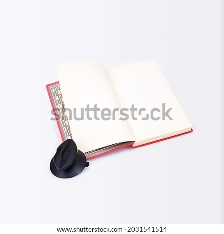 Open red book isolated on a white background