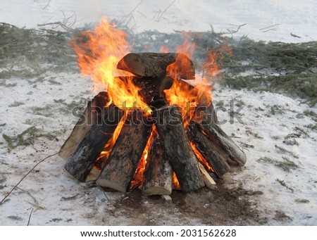  
Fire radiates warmth despite freezing temperature                              