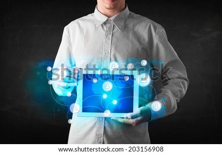 Young person holding talbet with earth communication technology concept