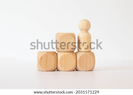 business man figures with wooden podium standing on blurred green background.