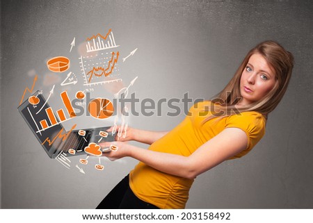 Beautiful young lady holding laptop with graphs and statistics