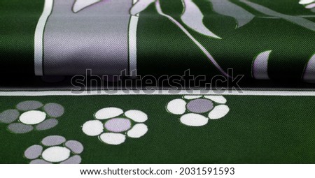Green blue fabric with print of white flowers, geometric lines. Introduces a new modern color palette, Texture, Background, Pattern.