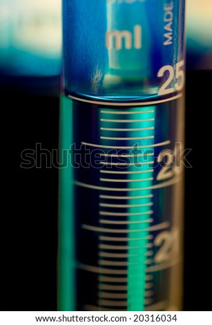 Graduated cylinder filled with blue dye