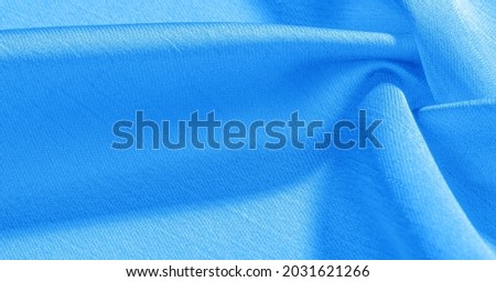 blue silk fabric. It has a smooth matte finish. Use this luxurious fabric for anything - from design to your projects. Background, pattern, texture