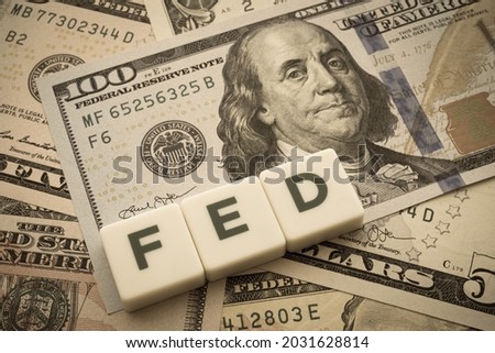 The Federal Reserve ( FED ) to control interest rates. World economy crisis, U.S. vs China trade or currency war concept. Interest rates affect the ability of consumers or businesses to access credit. Royalty-Free Stock Photo #2031628814