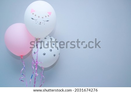 balloons with the image of a cat's face