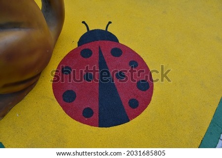 ladybug picture drawn on the ground
