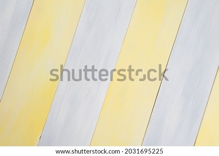background, light gray-yellow wooden surface
