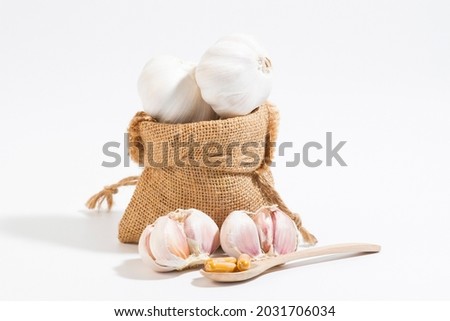 Garlic is antiviral and is a cold and flu remedy. Picture of spicy seasoning ingredients, head of garlic 