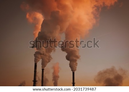 industries high smokestacks with smoke emission. Industrial factory pollution, smokestack exhaust gases. factory smokestack Royalty-Free Stock Photo #2031739487