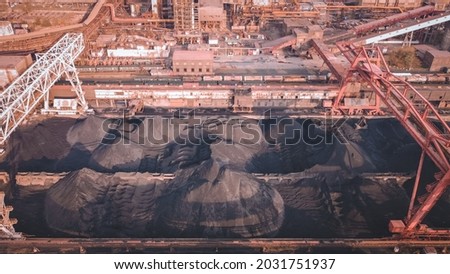 coal pile, coal preparation, train coal mining export shipment, work in coal handling terminal Royalty-Free Stock Photo #2031751937