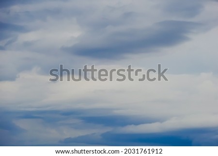 Navy sky background or backdrop with white clouds.