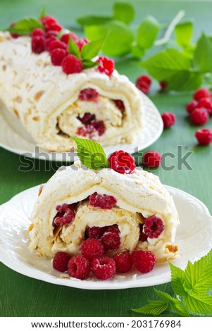 meringue roulade with cream and raspberries