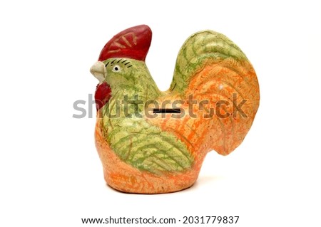 Colorful chicken piggy banks made of ceramic on a white background Royalty-Free Stock Photo #2031779837