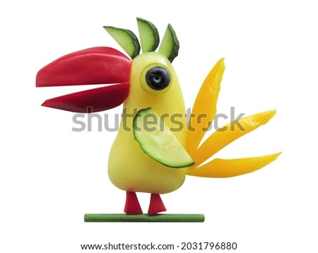 Funny parrot made of vegetables on a white background.