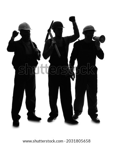 Silhouette of protesting miner men on white background Royalty-Free Stock Photo #2031805658