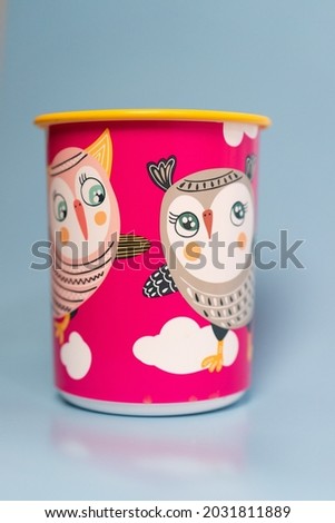 a cute storage area with an owl picture and quite large in diameter.