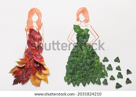 Drawn women in dresses made of autumn leaves on white background