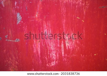 rusty metal texture with old chipped red paint. background