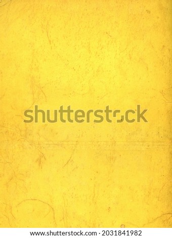 Driffed yellow background. Cardboard, back of book, dating from the 50s, damaged. Grunge material. Vintage.
