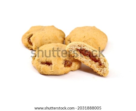 Shortbread cookies stuffed with jam on white background. Royalty-Free Stock Photo #2031888005