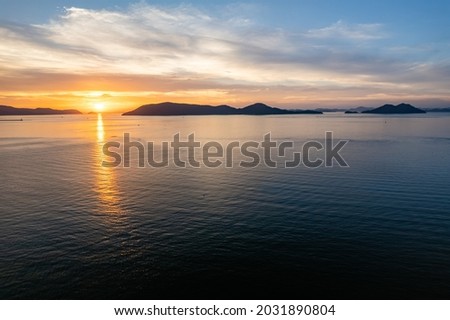 Tropical Landscape of Sea or Ocean and Waves at Sunset in Evening in Summer, Seto Inland Sea in Kagawa Prefecture in Japan, Travel or Trip, Aerial Top View from Flying Drone Royalty-Free Stock Photo #2031890804
