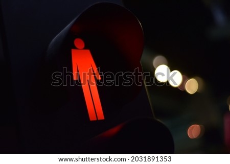 close-up of a red pedestrian traffic light.traffic light with RED light and don't walk ( move)