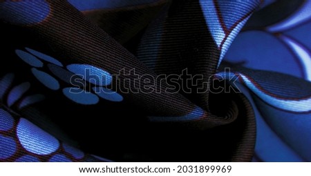 brown-blue fabric with a print of white flowers, geometric lines. Texture, background, pattern