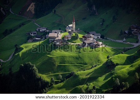 Amazing village with chapel in the South Tyrolean Alps in Italy - travel photography