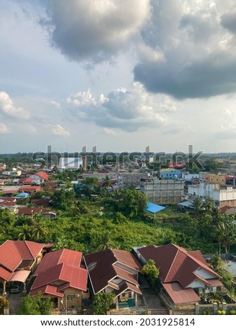 A view of Dumai City from a height with many houses in it. Home residents view in Dumai. Dumai cityscape in afternoon.