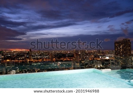 Evenings at the pool on the top floor hotel in the city for relaxing