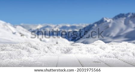 Winter background of snow and free space for your decoration. Landscape of mountains and blue sky. 