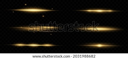 yellow horizontal lens flares pack. Laser beams, horizontal light rays. Beautiful light flares. Glowing streaks on dark background. Luminous abstract sparkling lined background. Royalty-Free Stock Photo #2031988682