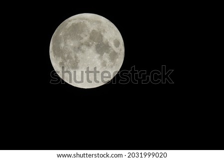 A full moon in a dark black sky, over Camp Verde, Yavapai County, Arizona.