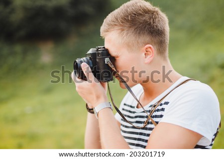 young boy takes on the camera in the park