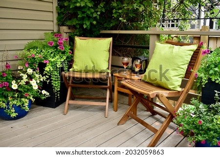 Relaxing secluded backyard garden patio oasis for summer afternoon glass of wine at vacation rental or home staycation