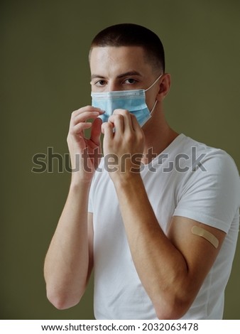 man wearing medical mask vaccine passport model dark background coronavirus