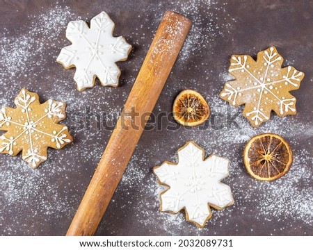 Delicious homemade gingerbread. Gingerbread cookies on a rusty wooden background. Cooking gingerbread. Christmas. 